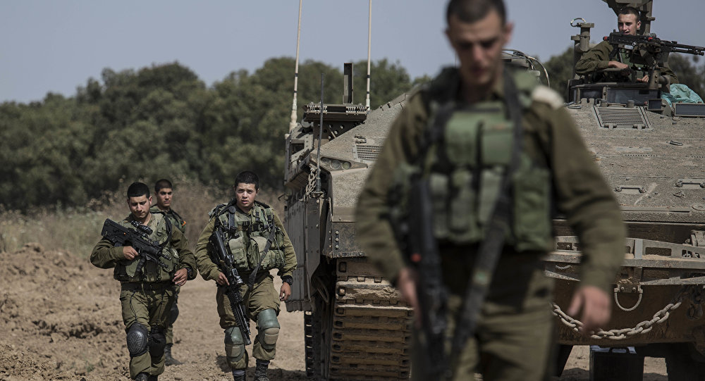 الجيش الإسرائيلي يحشد قوات كبيرة على حدود قطاع غزة ويحذر الفلسطينيين من الاقتراب