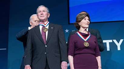 George W. Bush and his wife awarded Liberty Medal amid protests